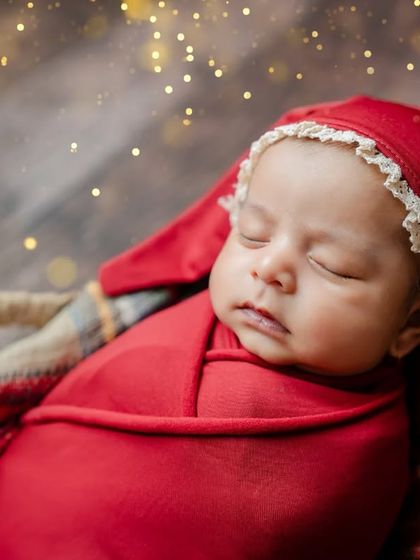 A dreamy close-up with sparkling lights to add a magical touch to your baby's first Christmas photos.