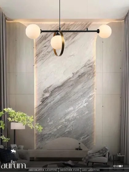A minimalist masterpiece, this linear pendant features three globe lights, one of which is accented with a brass ring. It's a sculptural piece that doubles as art, perfect for highlighting an architectural feature wall.