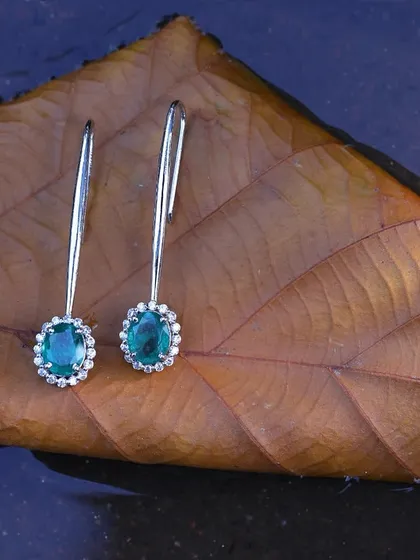Another example of our creative jewellery work. By placing these diamond and emerald earrings on a leaf floating on water, we created a serene and elegant mood that makes the product stand out.