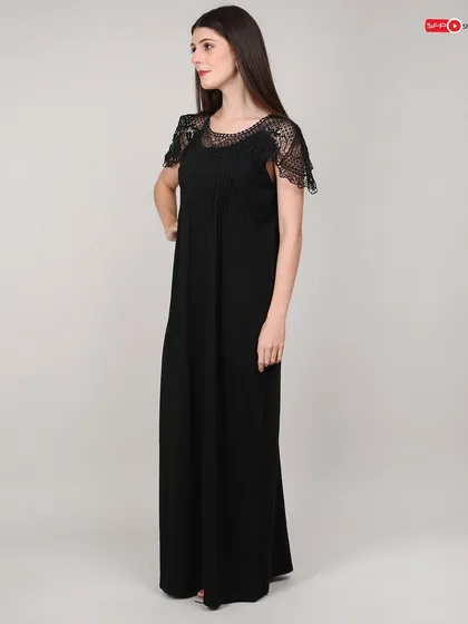 A side view of the black nightgown, providing a clear look at its silhouette and length.