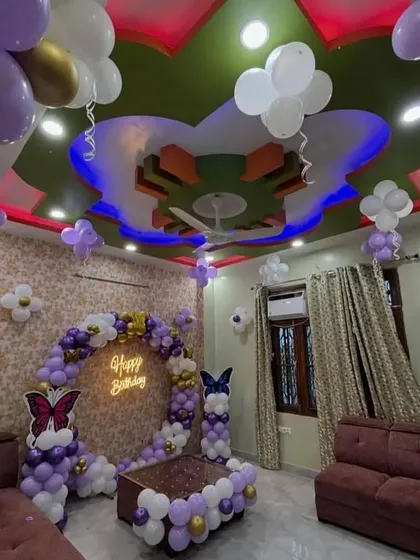 A full room view of the butterfly theme decoration, showing how we decorate the ceiling and walls to match the main backdrop.