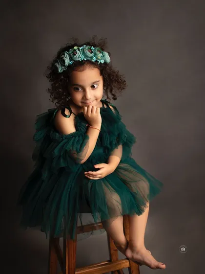 A pensive and sweet portrait. The simple setup allows her shy smile and curious eyes to be the main focus.