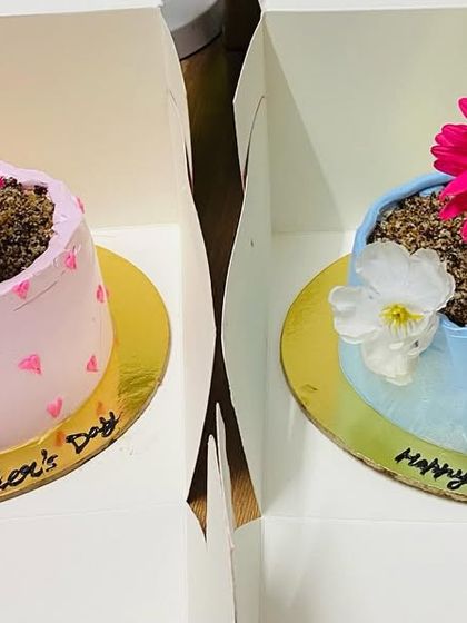 Two adorable flower pot cakes, a unique and sweet gift for Mother's Day.