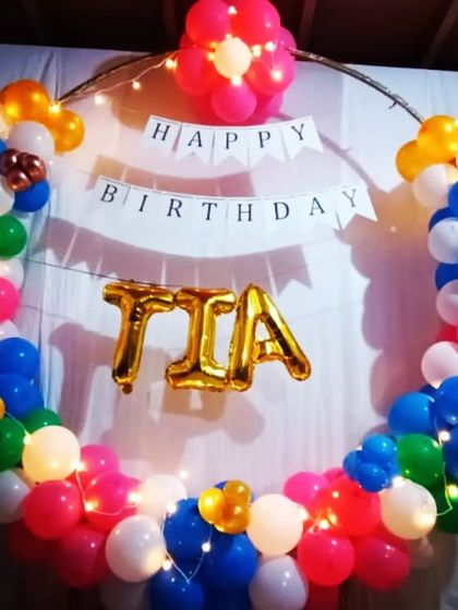 A simple yet colorful ring decoration for Tia's birthday, suitable for a small gathering or home party.