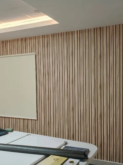 This is a simple, off-white roller blind I fitted in an office space. Roller blinds are durable and easy to use, making them a functional choice for commercial properties that need a clean look.