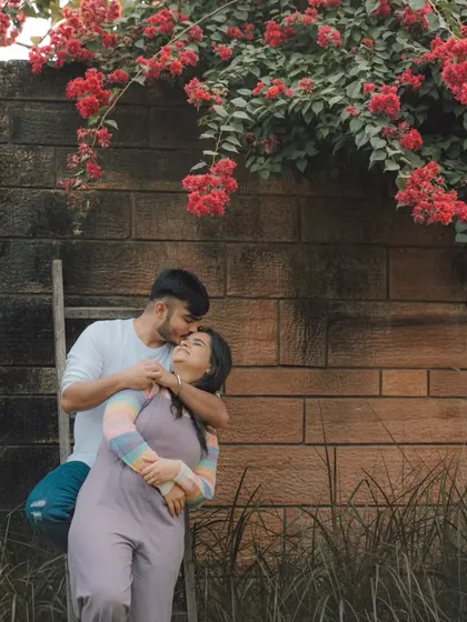 A tender moment during a pre-wedding session. We find beautiful, quiet spots where couples can just be themselves, allowing us to capture the genuine affection and connection they share.