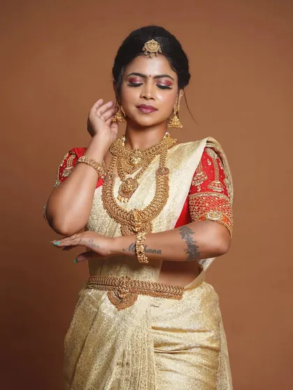 This bride is wearing a stunning antique set with a golden saree, a classic and timeless look.