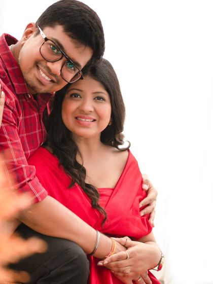 An intimate close-up of a couple sharing a happy moment. Their genuine smiles and easy affection make this a heartwarming and authentic portrait.