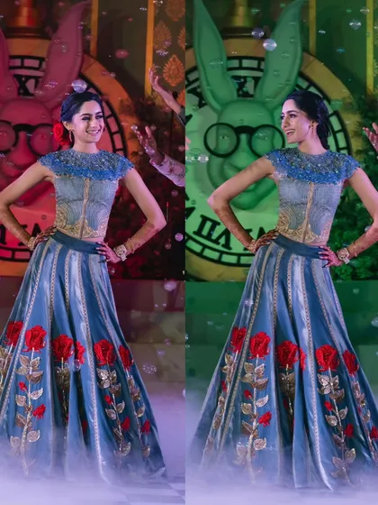 The bride strikes a pose, her custom lehenga with red rose details perfectly matching the 'Alice in Wonderland' theme. I often work with designers to ensure outfits complement the decor.
