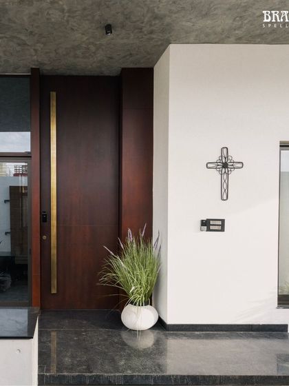 This is the 10-foot custom handle I created, seen on the main entrance of a modern home. The clean lines and warm brass finish provide a stunning contrast against the dark wood panels and minimalist facade, proving that grand scale can also be sleek and contemporary.