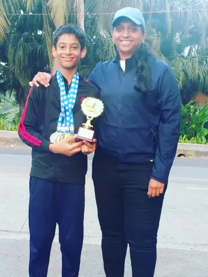 Nurturing the next generation of champions. I'm pictured here with my little champion, Devaj Parekh, after he won the Individual Championship in the Boys U/12 category. We are committed to developing young talent from an early age.