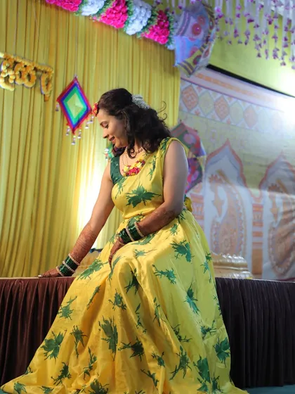 A candid moment of the bride during her haldi ceremony.
