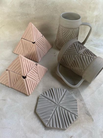 More prototypes from a student's beer-party-themed collection, showing the development process of the carved mugs and coasters.