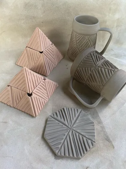 Another shot of the carved greenware, showcasing the precision and design of the collection.