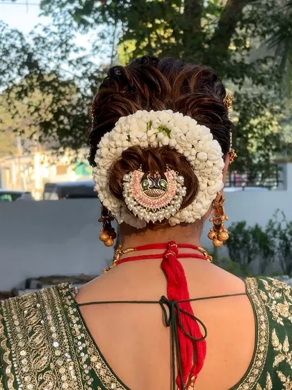 A detailed back view of the bridal bun with our handcrafted gajra.