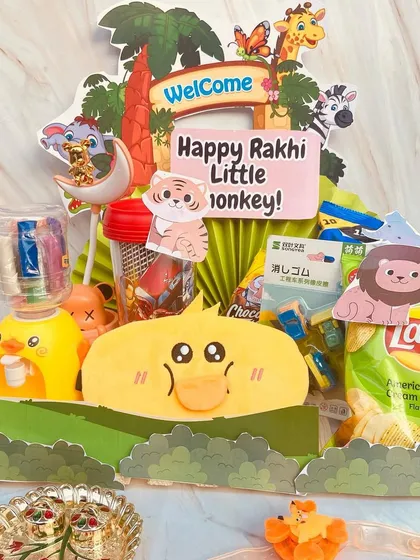 A playful Rakhi hamper for the "little monkey" in the family. This jungle-themed gift is packed with fun toys and snacks.