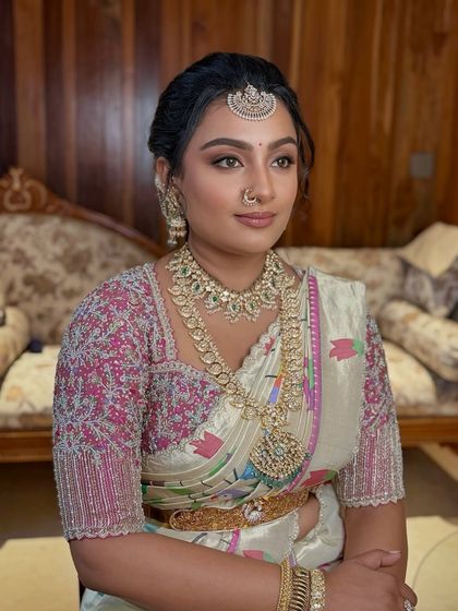 A close-up of another stunning bangle ceremony look, with beautifully detailed eye makeup and an elegant updo.