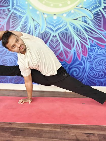 A full expression of Visvamitrasana, a pose that combines a deep side stretch, hamstring opening, and an arm balance.