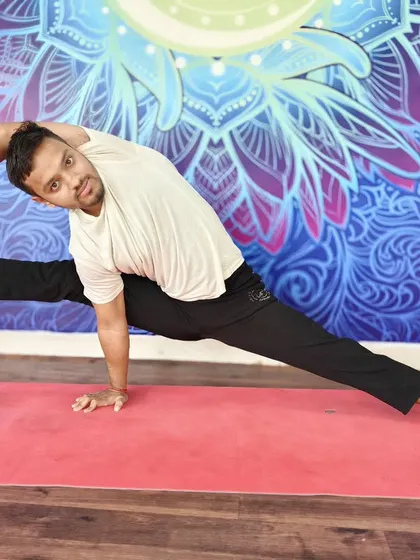 A full expression of Visvamitrasana, a pose that combines a deep side stretch, hamstring opening, and an arm balance.