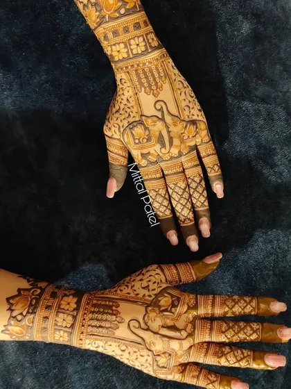 Another angle of the heavy back-hand design with elephant figures.