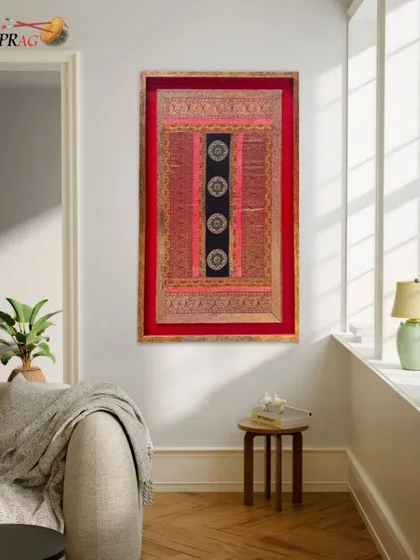 A traditional Indian textile artwork, beautifully preserved in a custom frame that complements its rich colors and intricate details.