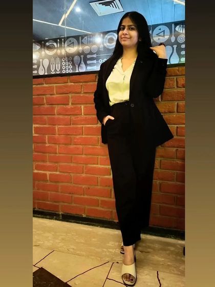 A professional portrait against a brick wall. My approach to law is solid and straightforward, just like the foundation of justice.