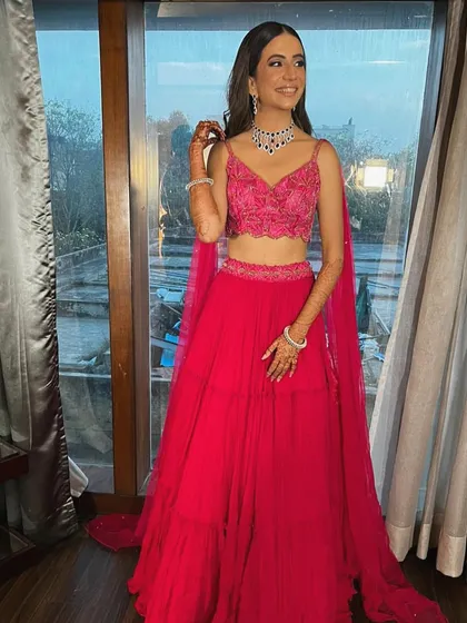 This is what a dream engagement look is made of. I styled Rhea in this vibrant fuchsia pink lehenga with an embroidered crop top and a delicate diamond necklace, creating a look that is modern, fresh, and absolutely stunning.