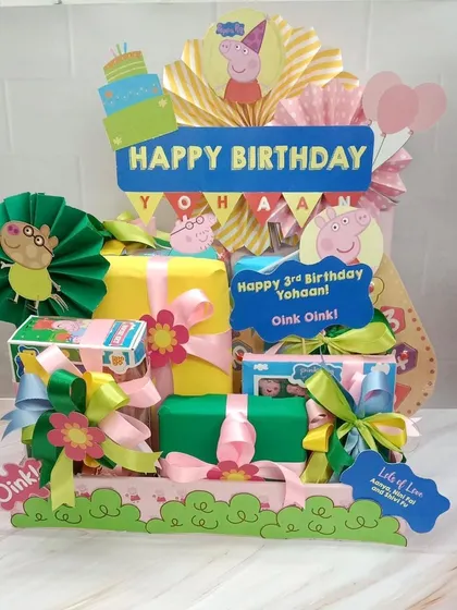 This hamper is oink-tastic. A Peppa Pig themed birthday arrangement, perfect for any young fan, filled with themed gifts and decorations.