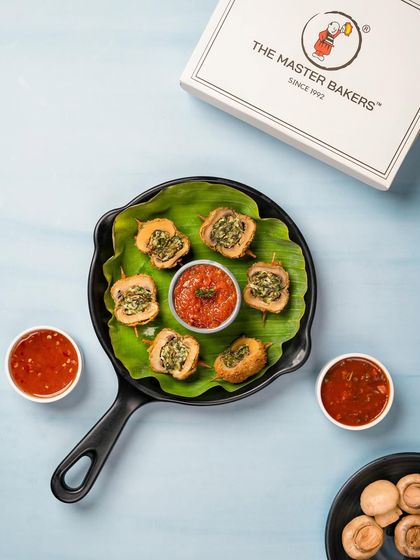 Our Mushroom Duplex is a savory appetizer where mushrooms are stuffed with a flavorful mixture, coated, and fried until crispy on the outside and soft on the inside.