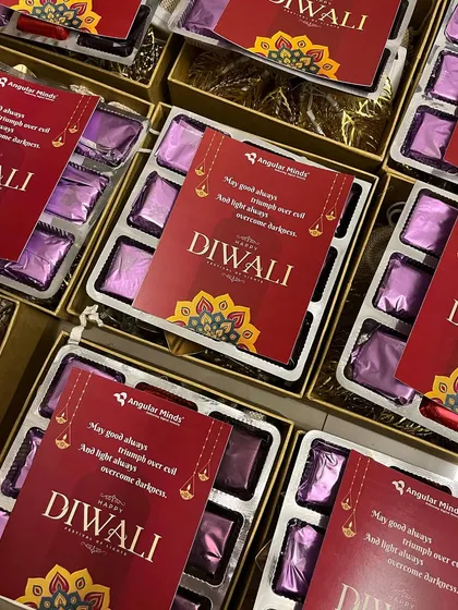 Custom-branded chocolate boxes for Angular Minds, a simple yet effective way to add a personal touch to festive corporate gifts.