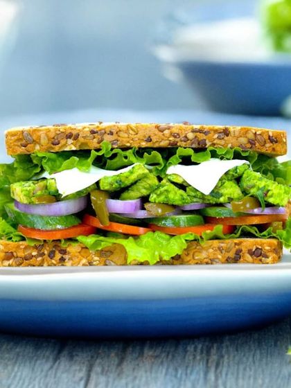 A festive twist on a classic. Our Tossed Chicken Sarson Da Saag Sandwich combines the earthy flavors of traditional saag with tender chicken, all packed into a wholesome multigrain sandwich. It’s a Lohri special you'll love.