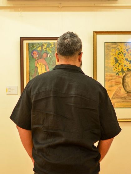 A visitor takes a moment to appreciate the art on display. We are sharing these guest photos as we bid adieu to a splendid exhibition.