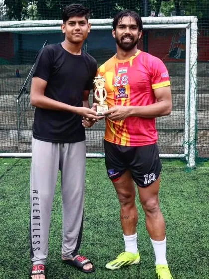 Our player receiving the Top Scorer award at the Clash of Champions.