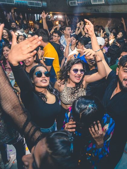 A high-energy moment with everyone's hands in the air. This is the collective euphoria I aim for.