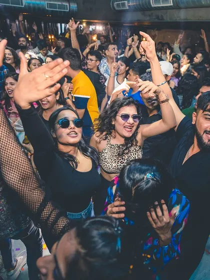 A high-energy moment with everyone's hands in the air. This is the collective euphoria I aim for.