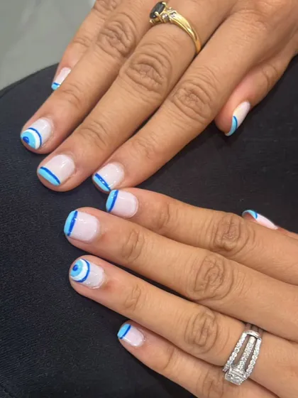 The evil eye design is so popular, and I love creating different versions of it. For this set, I hand-painted the symbol in shades of blue on a neutral base. This is a great way to have trendy and meaningful art right on your fingertips.