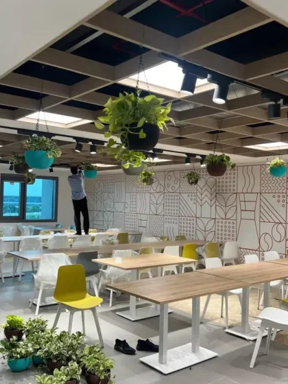 A view of our team during the installation process for an office cafeteria. We handle every detail to ensure the final design is perfectly executed, bringing a fresh and vibrant atmosphere to the workspace.