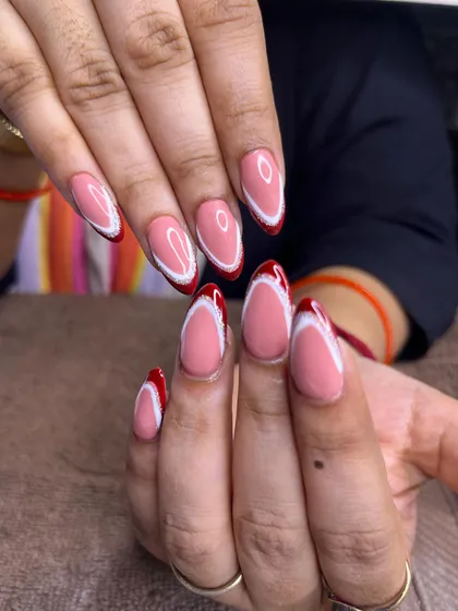 A beautiful shot of the double-lined French manicure in red and white, a perfect design for any festive occasion.