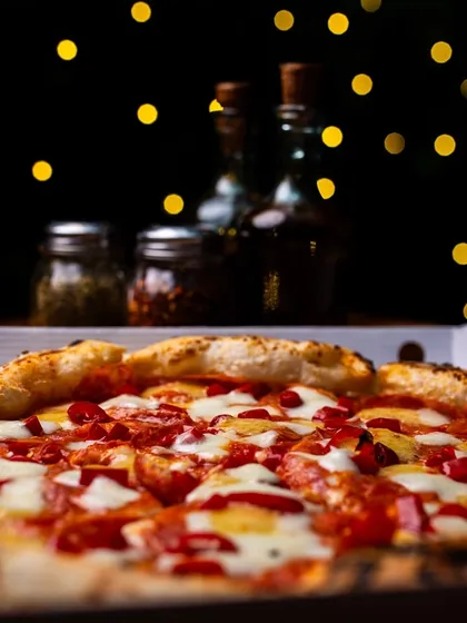 Fairy lights and pizza at our Amar Colony outlet. You can also get this deliciousness delivered.