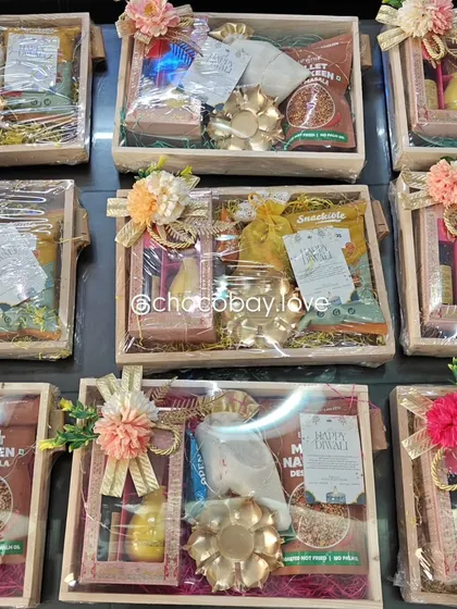 A collection of my customizable wooden gift hampers, beautifully arranged and wrapped for a client order.
