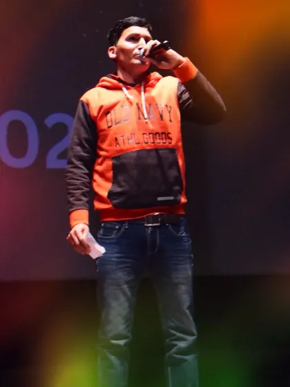 Our event host on stage at Pehal, keeping the energy high between performances. It takes a whole team to make our annual showcase a success.