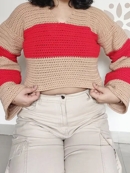 The cropped length of the Cotton Candy Sweater makes it perfect for pairing with high-waisted pants.
