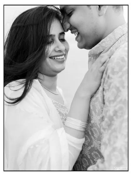 An intimate black and white close-up, capturing the genuine smiles and affection of a couple during their Varanasi pre-wedding shoot.