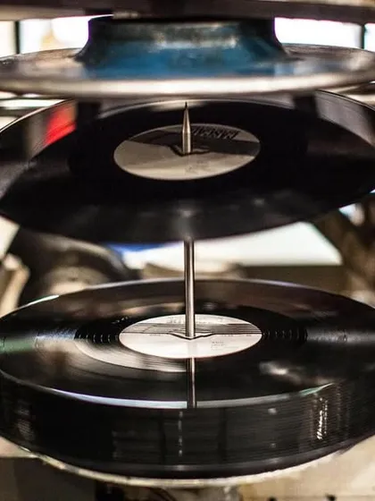 A shot of vinyl records being pressed. I'm always working on new projects to push analog culture forward, including managing the production of dream vinyl releases.