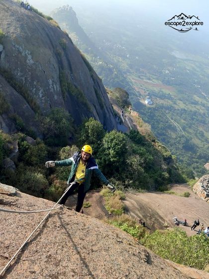 A trekker expertly navigating the rock face during our rappelling activity.