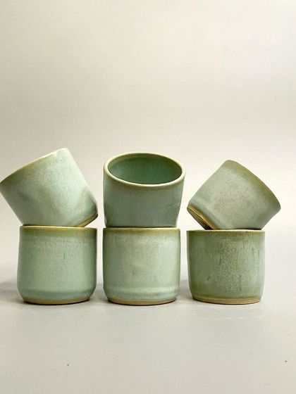 Indulge in the artistry of everyday moments with these handcrafted ceramic tumblers in a soft seafoam green. Each piece is meticulously crafted to bring elegance and functionality to your day.