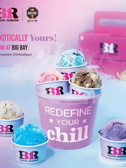 An ad for Baskin Robbins, showing their "Redefine Your Chill" family packs, perfect for sharing a sweet treat with your travel companions.