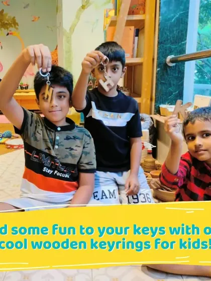 Kids showing off the wooden keyrings they designed and painted. It's a small project that gives a big sense of accomplishment.