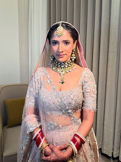 A portrait of Anmol, showcasing her poise and the timeless quality of her bridal makeup.