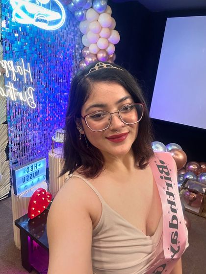 A selfie from the birthday girl, capturing her joy and the beautiful, sparkling decor behind her. Our venues are perfect for getting those happy birthday selfies.